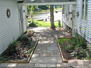 Stone patio and entrance from parking